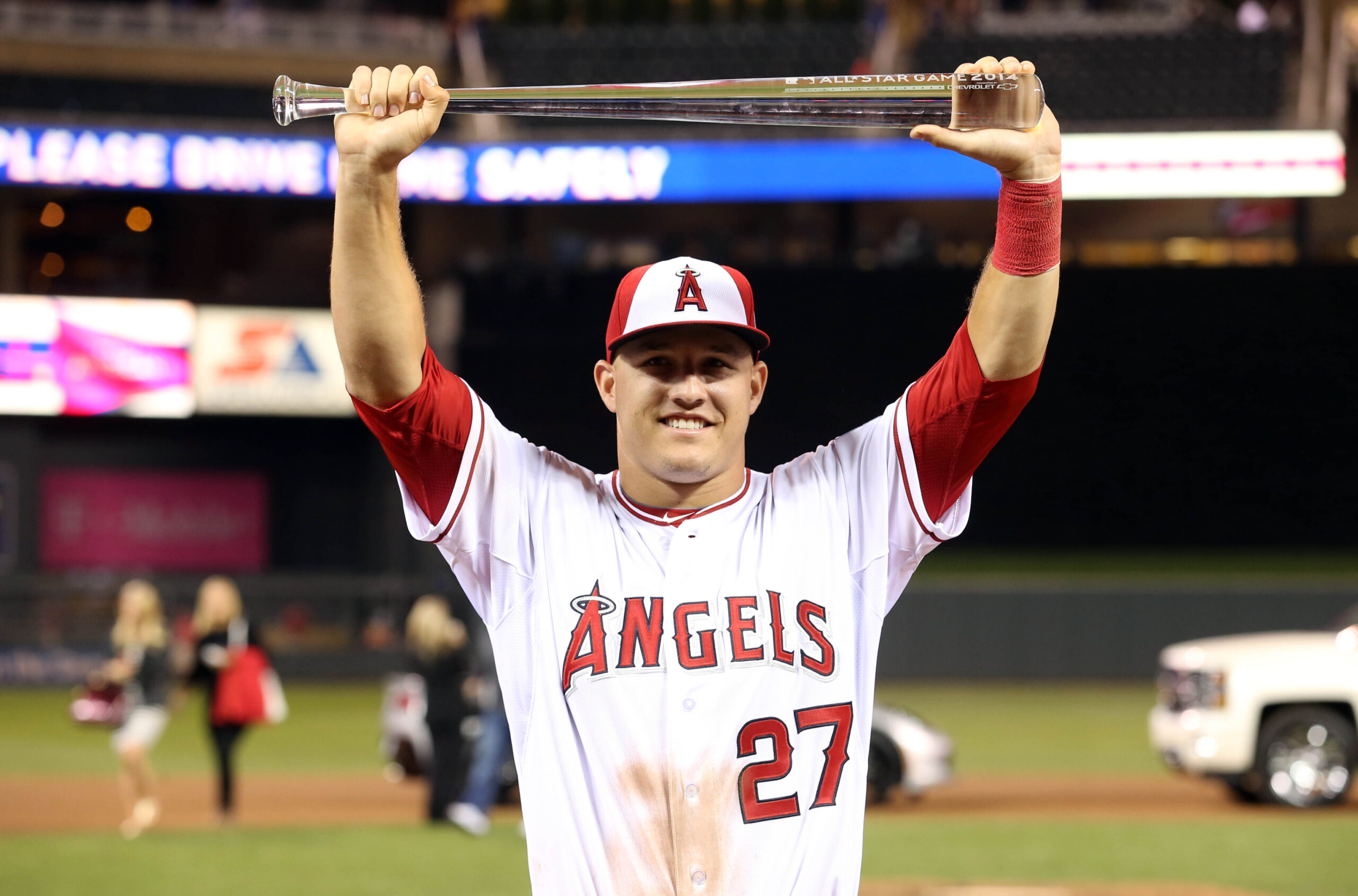 Trout holding MVP trophy