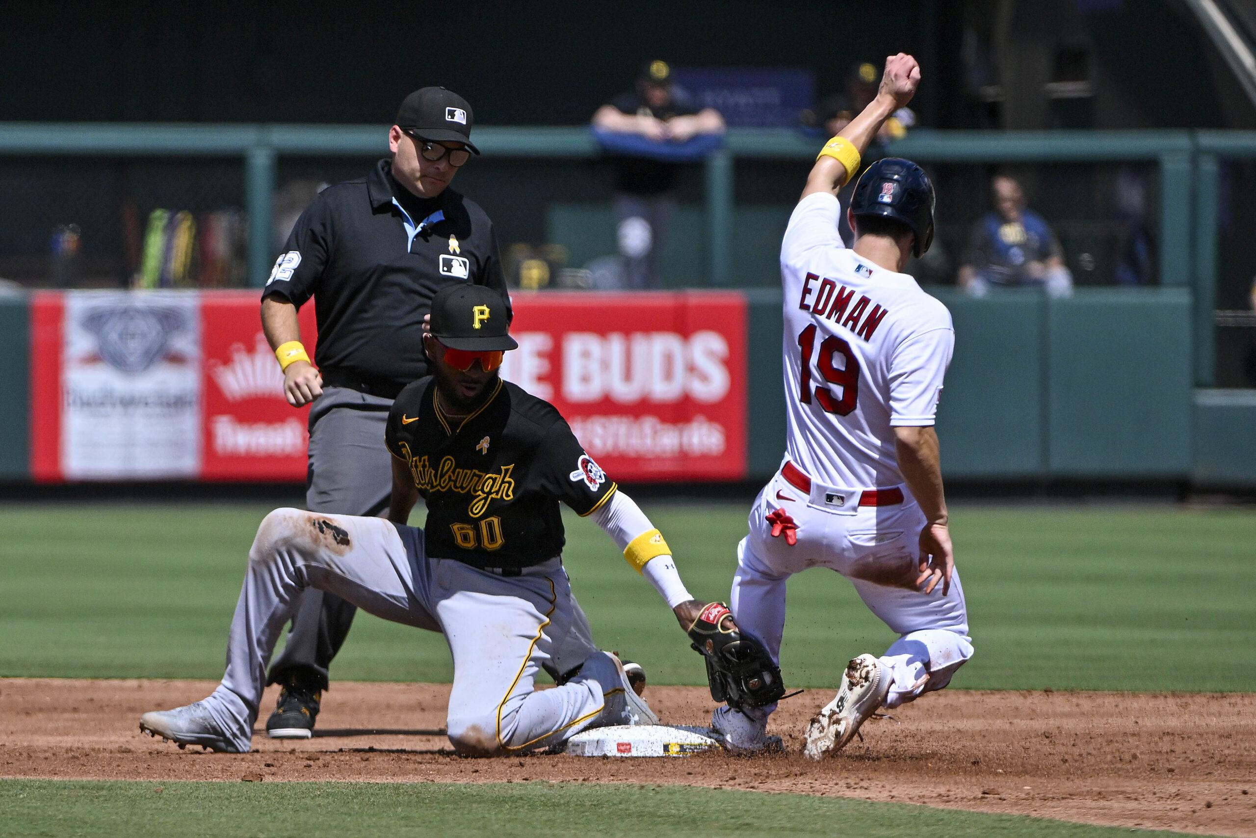 baseball player slides past second base