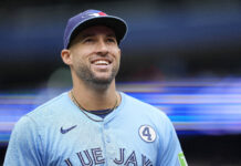 Braves Set to Trade for $150 Million Star in Latest MLB Mock Portrait of a smiling baseball player wearing a light blue jersey and cap, standing in a stadium setting.